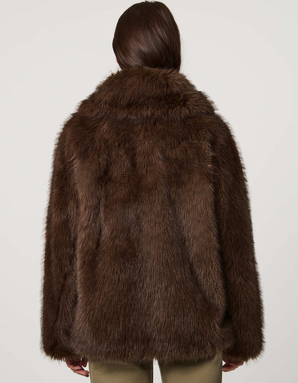 Hip-length faux fur coat with oversized collar, four-button single-breasted front, and welt pockets.