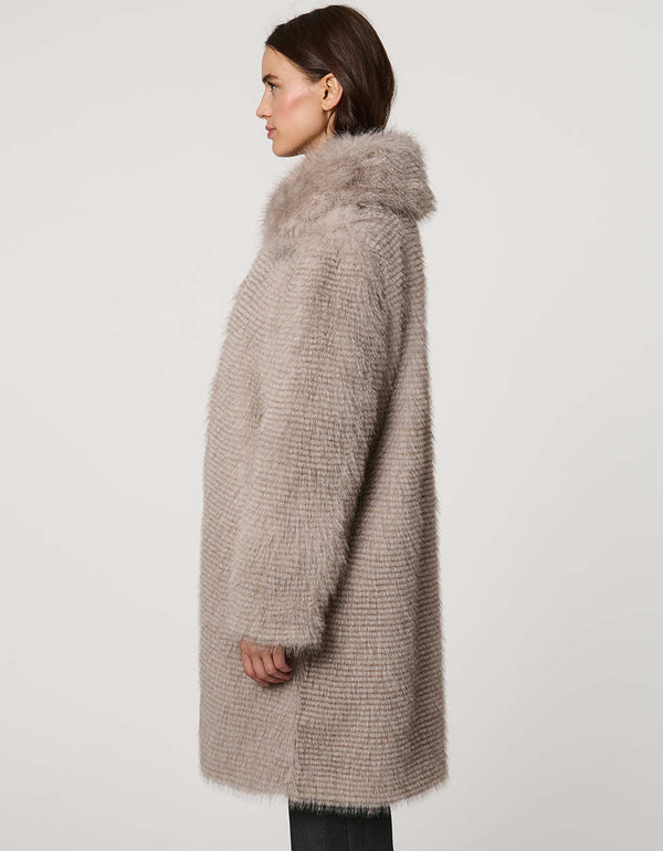 Knee-length ostrich-textured faux fur coat with oversized collar, discreet clip closures, and welt pockets.
