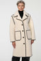 Calf-length faux fur coat with scalloped stitching, oversized lapels, and patch pockets for cozy sophistication.