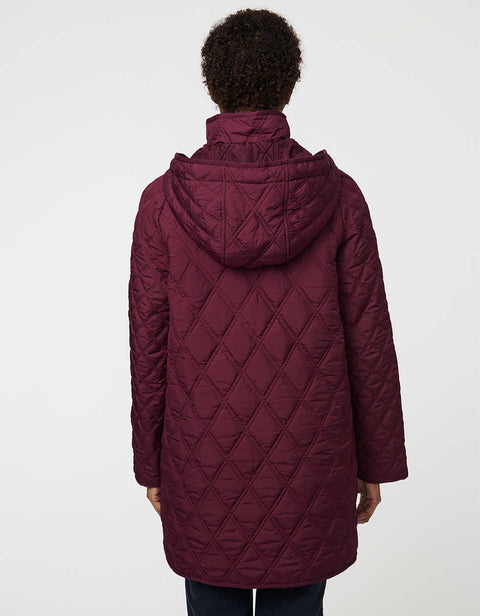 Lightweight quilted puffer jacket for women. The perfect spring layer with drawstring hood and oversized pockets,