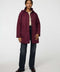 Lightweight quilted puffer jacket for women. The perfect spring layer with drawstring hood and oversized pockets,