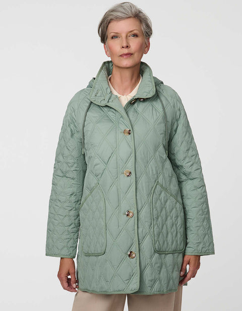 Lightweight quilted puffer jacket for women. The perfect spring layer with drawstring hood and oversized pockets,