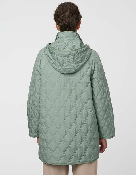 Lightweight quilted puffer jacket for women. The perfect spring layer with drawstring hood and oversized pockets,