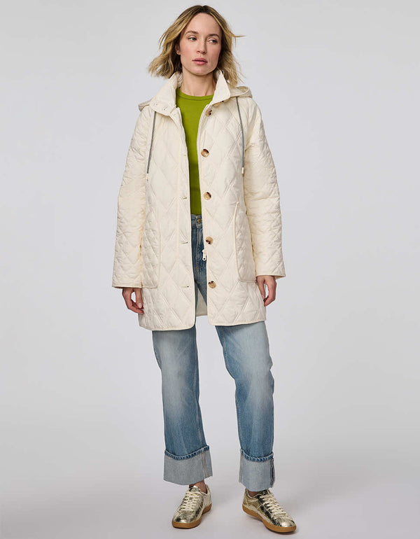 Lightweight quilted puffer jacket for women. The perfect spring layer with drawstring hood and oversized pockets,