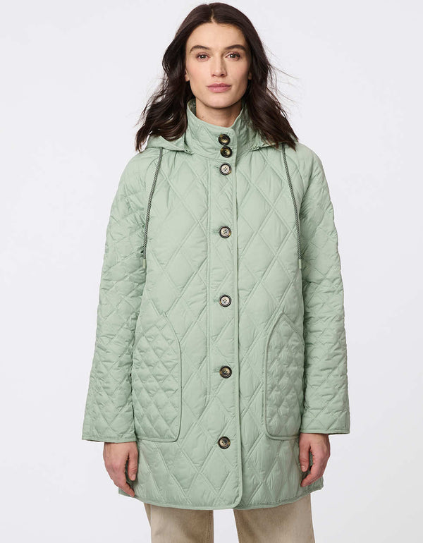 Lightweight quilted puffer jacket for women. The perfect spring layer with drawstring hood and oversized pockets,