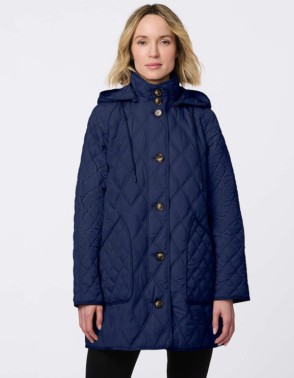 Lightweight quilted puffer jacket for women. The perfect spring layer with drawstring hood and oversized pockets,