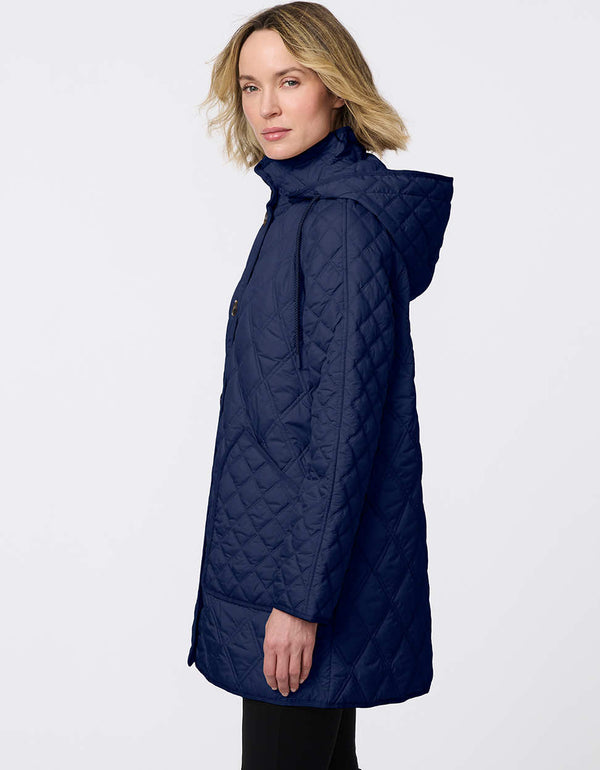 Lightweight quilted puffer jacket for women. The perfect spring layer with drawstring hood and oversized pockets,