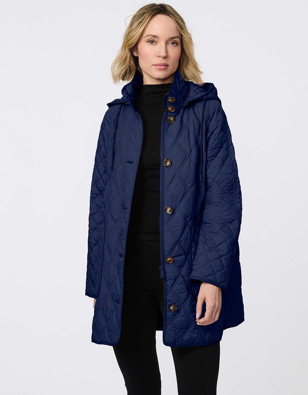 Lightweight quilted puffer jacket for women. The perfect spring layer with drawstring hood and oversized pockets,