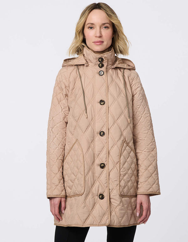 Lightweight quilted puffer jacket for women. The perfect spring layer with drawstring hood and oversized pockets,