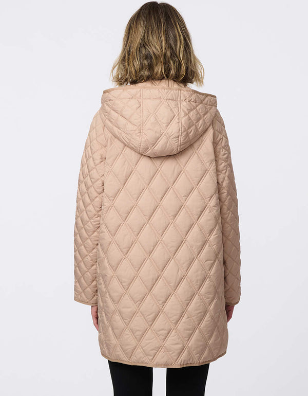 Lightweight quilted puffer jacket for women. The perfect spring layer with drawstring hood and oversized pockets,