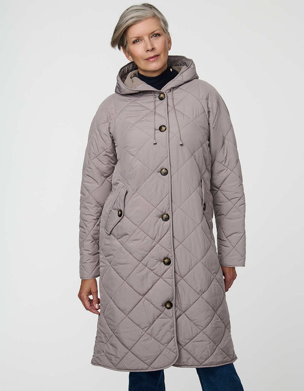 Merrick Quilted Puffer Coat with diamond quilting, welt pockets, and knee-length fit.