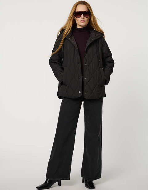 Oversized quilted puffer jacket with diamond stitching, drawstring hood, welt pockets, and snap front closures.