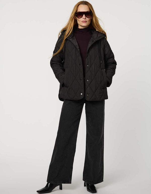 Oversized quilted puffer jacket with diamond stitching, drawstring hood, welt pockets, and snap front closures.