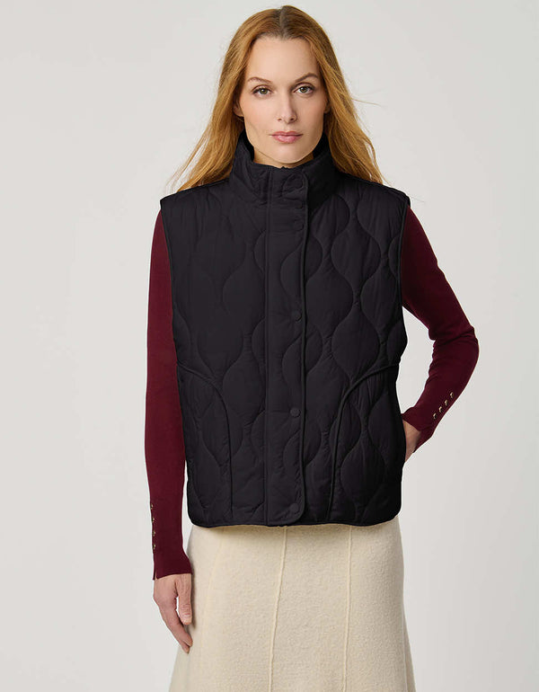 Women’s quilted puffer vest with oversized fit, funnel collar, zipper closure, and lightweight Ecoplume fill.