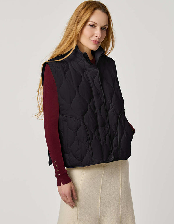 Women’s quilted puffer vest with oversized fit, funnel collar, zipper closure, and lightweight Ecoplume fill.