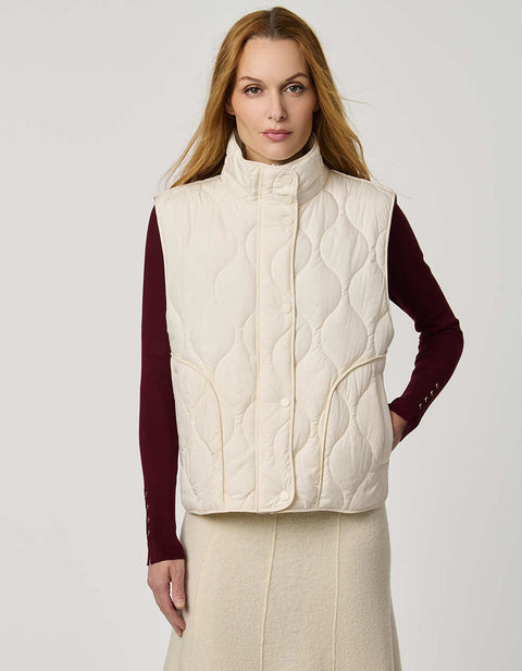 Women’s quilted puffer vest with oversized fit, funnel collar, zipper closure, and lightweight Ecoplume fill.