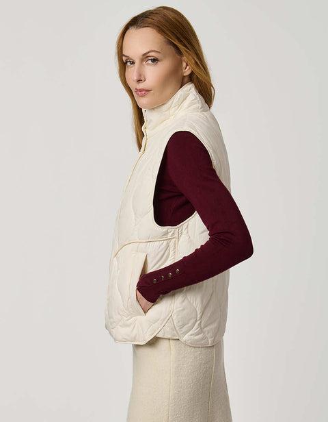 Women’s quilted puffer vest with oversized fit, funnel collar, zipper closure, and lightweight Ecoplume fill.