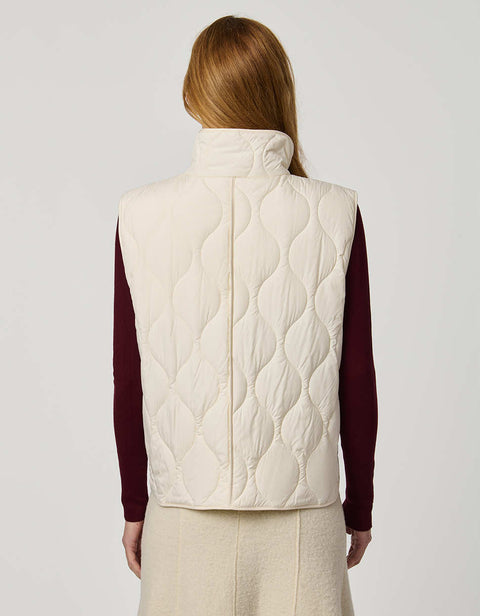 Women’s quilted puffer vest with oversized fit, funnel collar, zipper closure, and lightweight Ecoplume fill.
