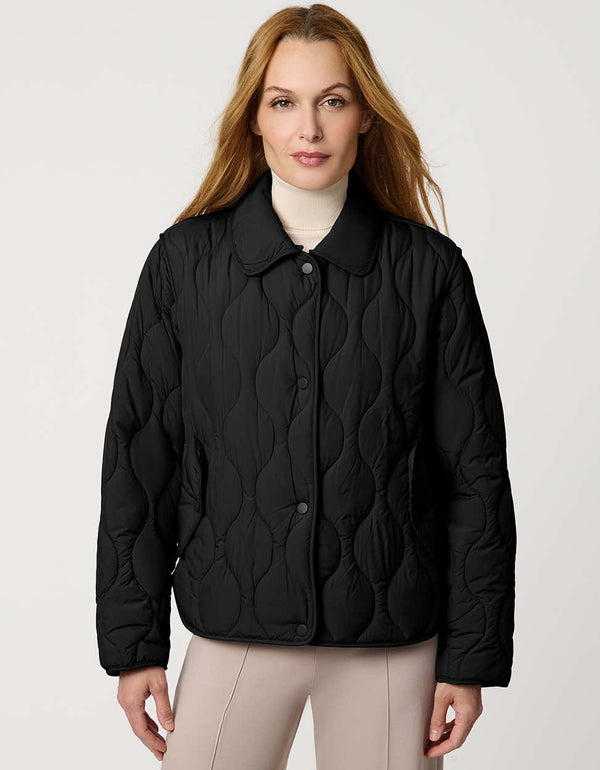 Classic quilted women’s puffer jacket with structured collar, snap closures, patch pockets, and Ecoplume fill.