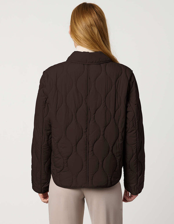 Classic quilted women’s puffer jacket with structured collar, snap closures, patch pockets, and Ecoplume fill.
