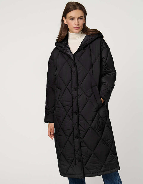 Oversized long puffer coat with diamond quilting, corduroy trim, hood, welt pockets, and Ecoplume insulation.