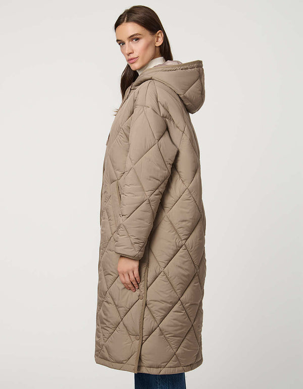 Oversized long puffer coat with diamond quilting, corduroy trim, hood, welt pockets, and Ecoplume insulation.