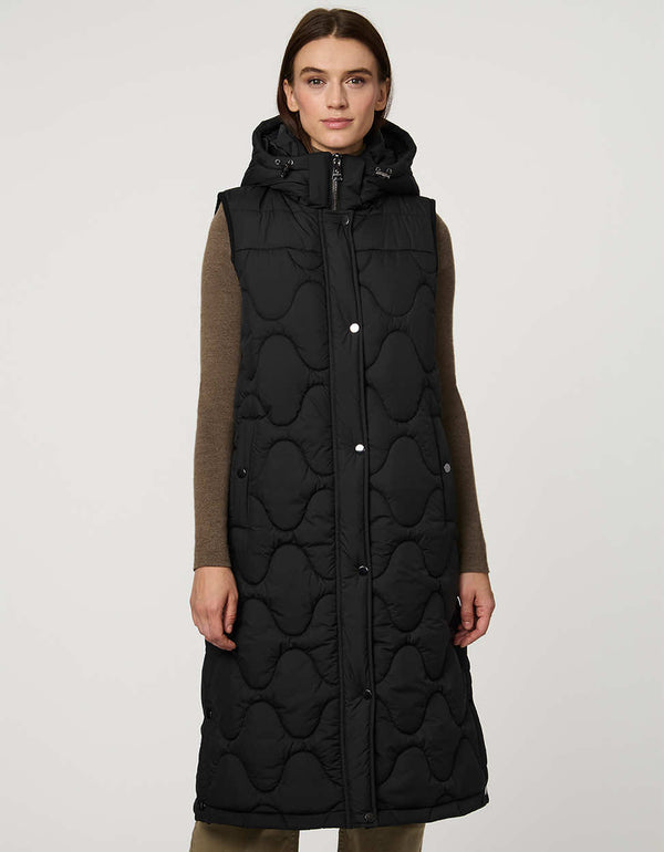 fashionable womans trendy puffer vest in black for winter season in a walker length with oversized fit for comfort