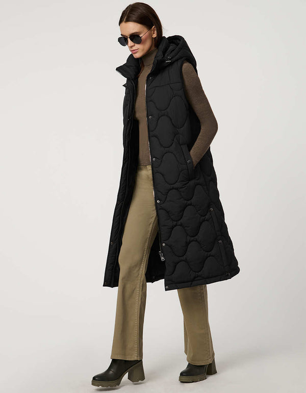 fashionable womans trendy puffer vest in black for winter season in a walker length with oversized fit for comfort