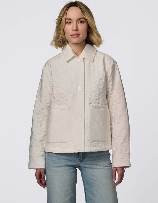 Lightweight and endlessly versatile, the Skyline Quilted Jacket blends classic quilting with modern utility. Oversized patch pockets add a stylish touch, while the adjustable drawstring hem lets you tailor the shape—wear it relaxed and straight or cinch it for a bubble effect. A snap-front closure ensures layering is effortless, making this the perfect transitional piece to complement any outfit from day to night.