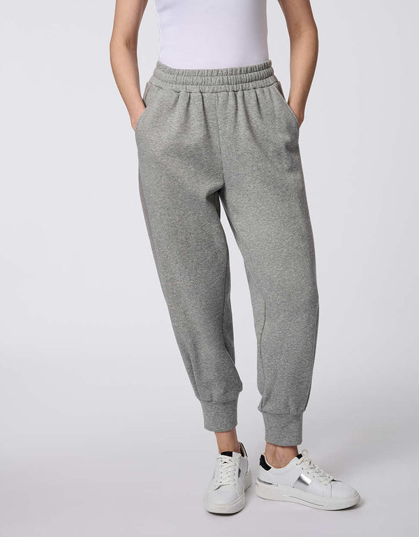 Cozy Essential Jogger pants, fleece-knit with an elastic waistband and ribbed cuffs, designed for comfort and effortless style.