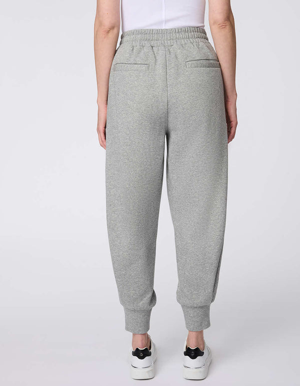 Cozy Essential Jogger pants, fleece-knit with an elastic waistband and ribbed cuffs, designed for comfort and effortless style.