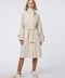 Oversized trench coat with fold-away hood, funnel collar, flared sleeves, and zip closure. Versatile and chic, perfect for city streets and weekend getaways.