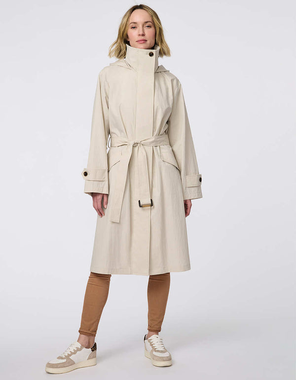 Oversized trench coat with fold-away hood, funnel collar, flared sleeves, and zip closure. Versatile and chic, perfect for city streets and weekend getaways.