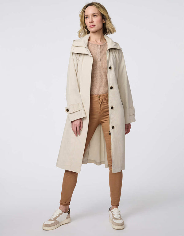 Oversized trench coat with fold-away hood, funnel collar, flared sleeves, and zip closure. Versatile and chic, perfect for city streets and weekend getaways.