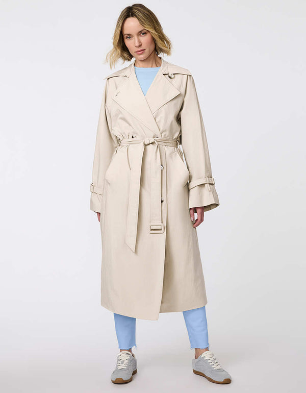 Women's classic beige trench coat. Lightweight, design with a self-tie belt, double-breasted closure. Perfect for layering in transitional weather.