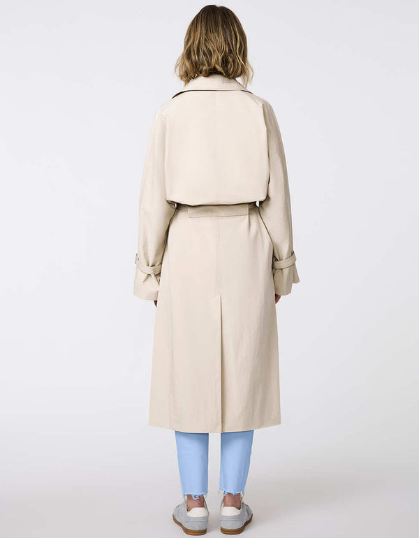 Women's classic beige trench coat. Lightweight, design with a self-tie belt, double-breasted closure. Perfect for layering in transitional weather.