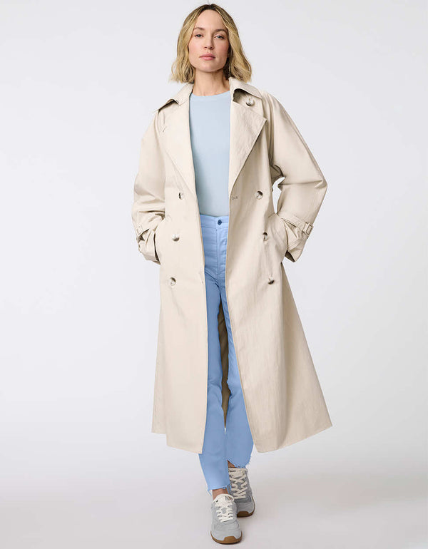 Women's classic beige trench coat. Lightweight, design with a self-tie belt, double-breasted closure. Perfect for layering in transitional weather.