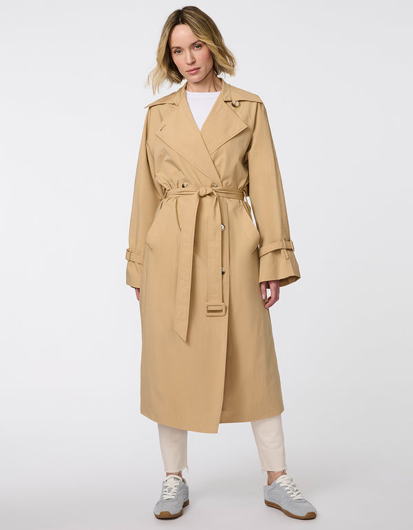 Women's classic beige trench coat. Lightweight, design with a self-tie belt, double-breasted closure. Perfect for layering in transitional weather.