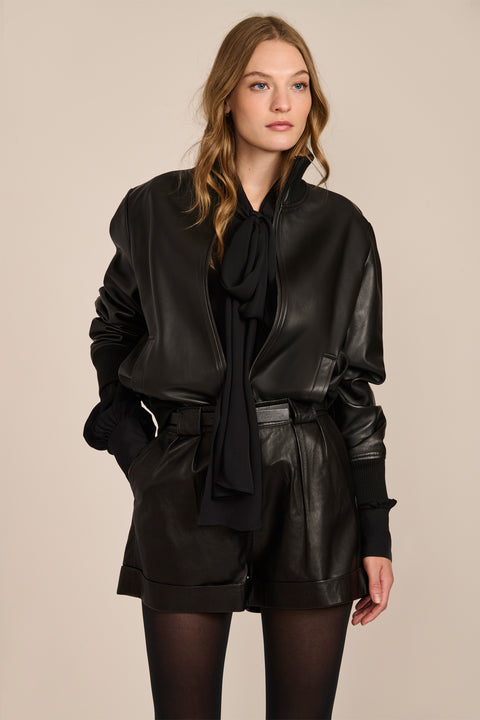 Women's black genuine leather bomber jacket with zip-front closure, stand collar and rib-knit trim