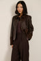 Women's suede and leather barn jacket with utility pockets and stand collar in camel brown