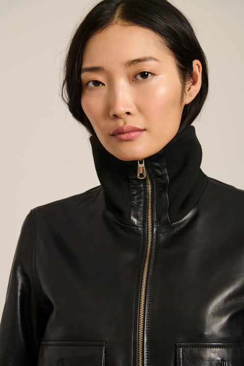 Women's genuine leather bomber jacket with rib-knit trim and utility pockets in black