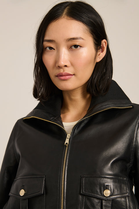 Women's genuine leather bomber jacket with rib-knit trim and utility pockets in black