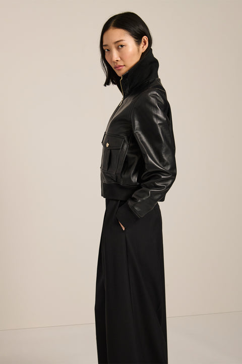 Women's genuine leather bomber jacket with rib-knit trim and utility pockets in black
