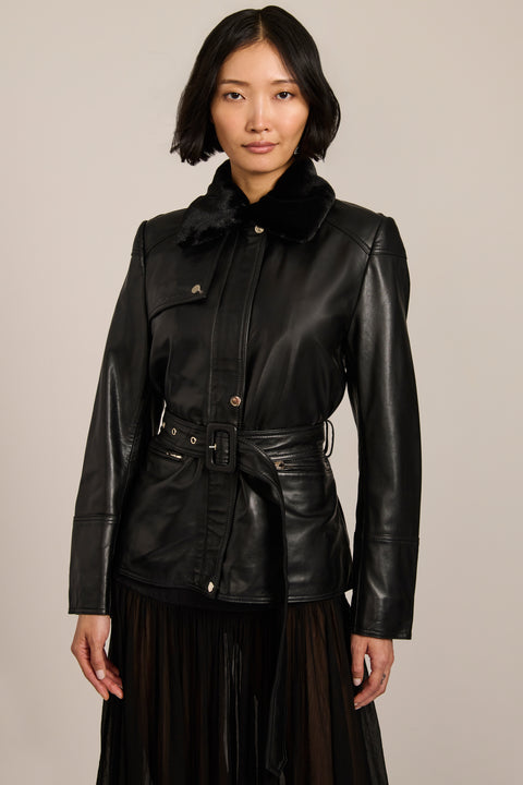 women's black genuine leather belted jacket with a removable black faux fur collar, snap-front closure and utility pockets.