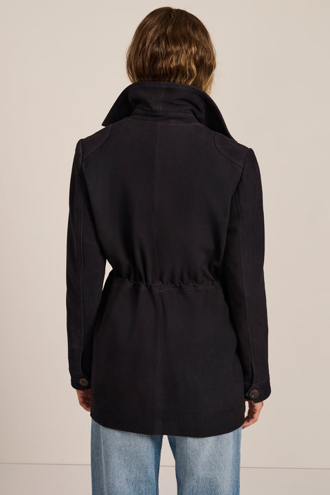 Women's genuine suede safari jacket with adjustable drawcord waist and four patch pockets.