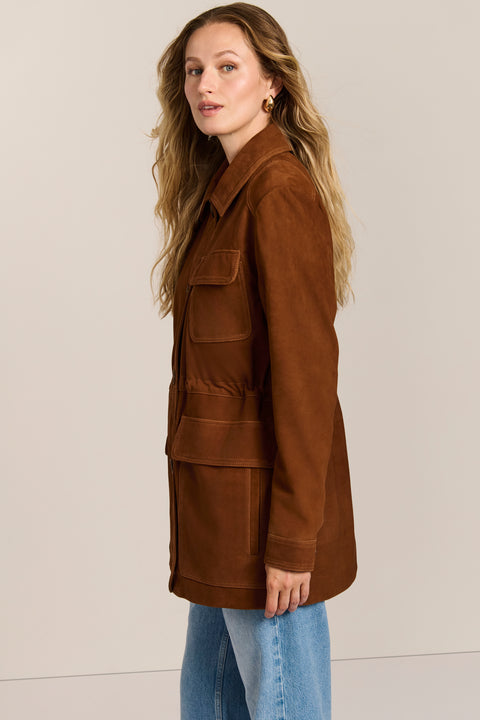 Women's genuine suede safari jacket with adjustable drawcord waist and four patch pockets.