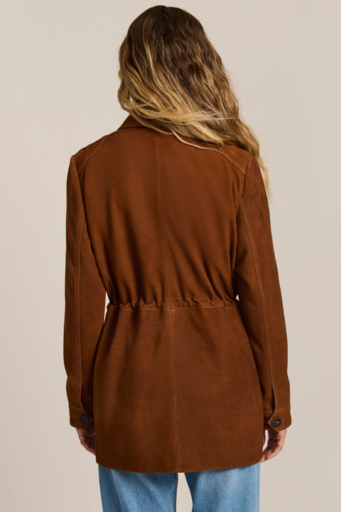 Women's genuine suede safari jacket with adjustable drawcord waist and four patch pockets.
