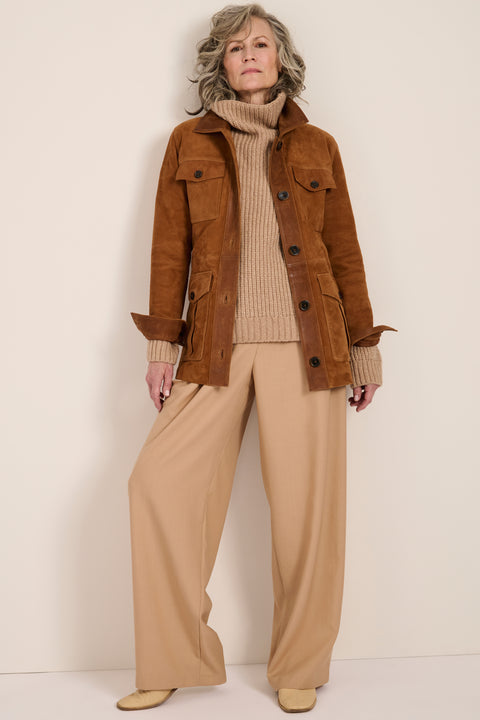 Genuine suede safari jacket with leather trim, self-tie belt, oversized flap pockets and concealed button-front closure.
