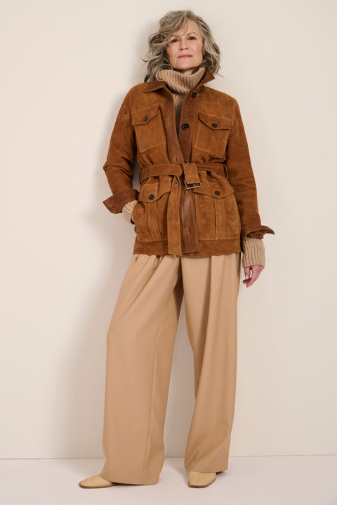 Genuine suede safari jacket with leather trim, self-tie belt, oversized flap pockets and concealed button-front closure.