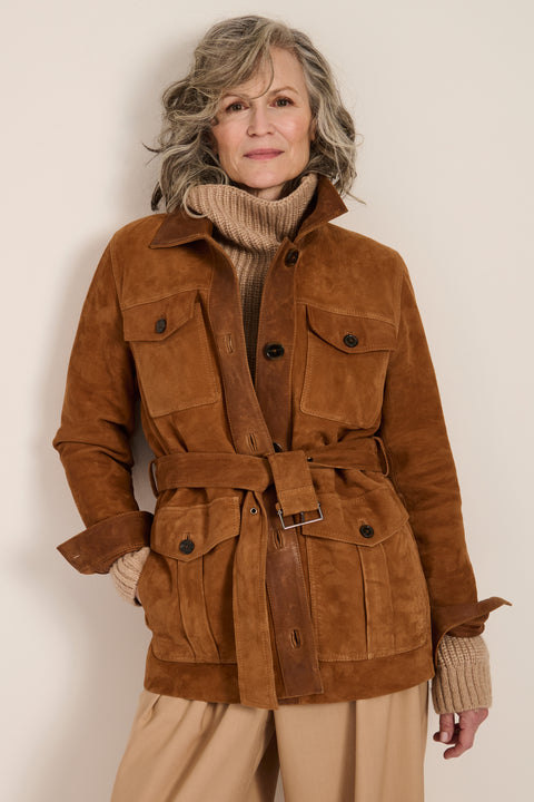 Genuine suede safari jacket with leather trim, self-tie belt, oversized flap pockets and concealed button-front closure.